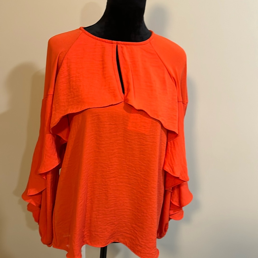 Bright orange Exotic designer cascade top. Never worn. New w/ tag.